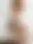 Sentada na Cama de Lingerie